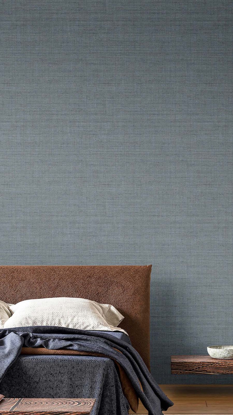 Papel de parede texturado azul num quarto